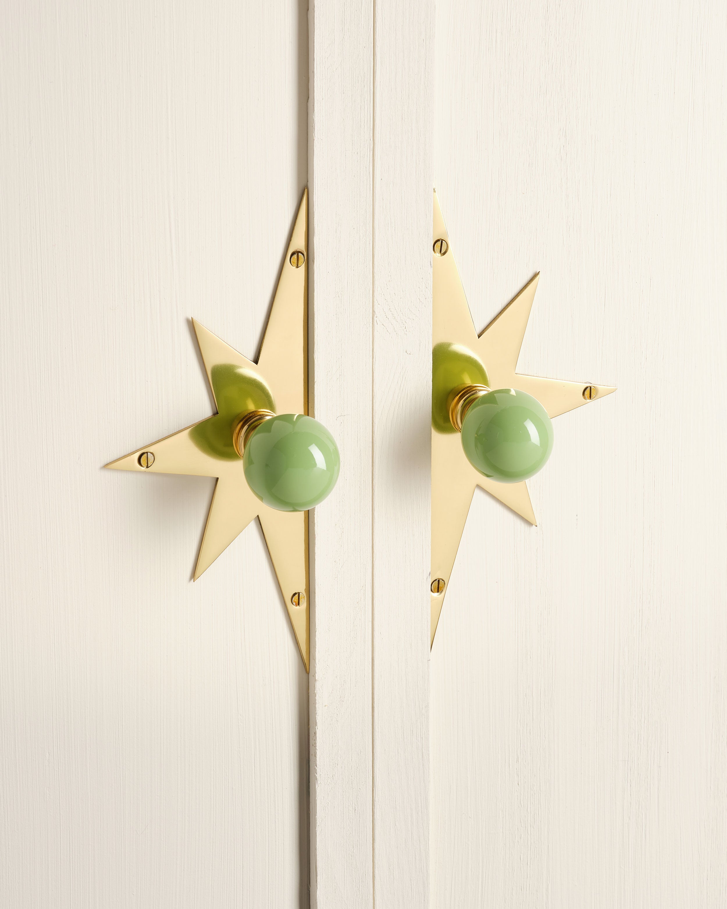 Pair of Star Backplates, Polished Brass